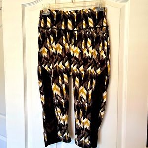 Ladies exercise pants. Black, gold, and cream colors.